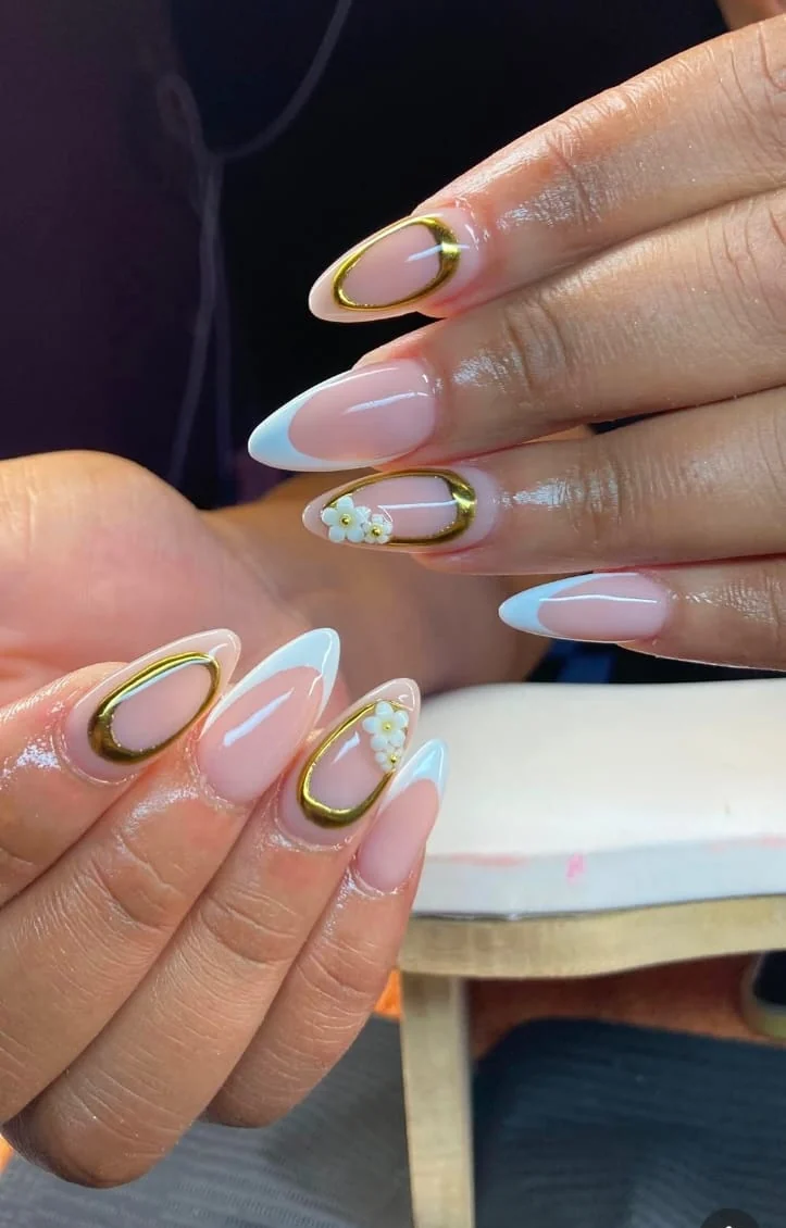 Blush and white almond nails with delicate gold detailing