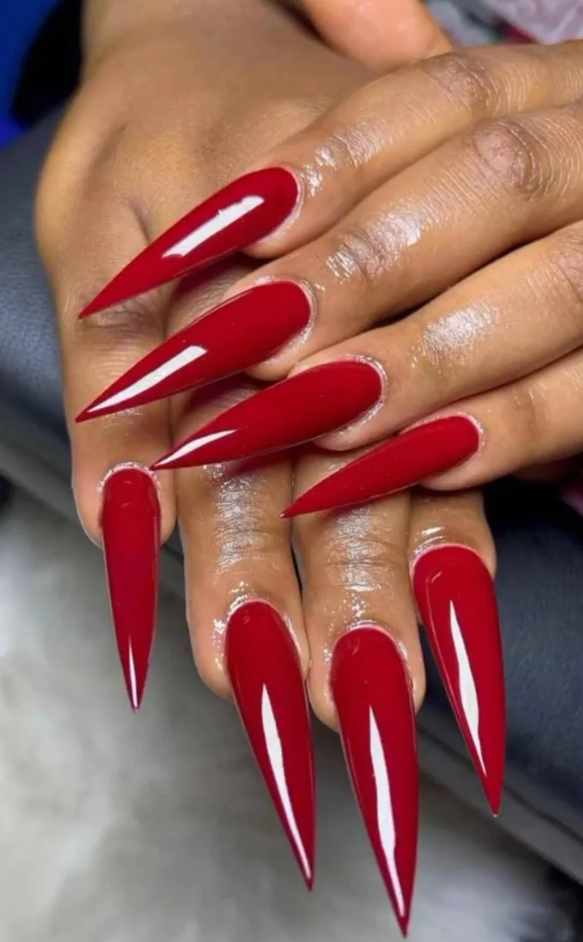 Glossy deep red stiletto nail design